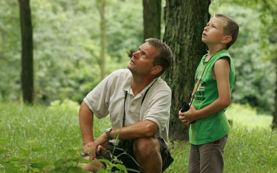 father and son birdwatching